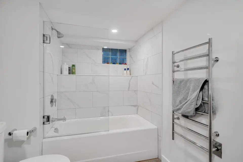 White marble bathroom with towel warmer