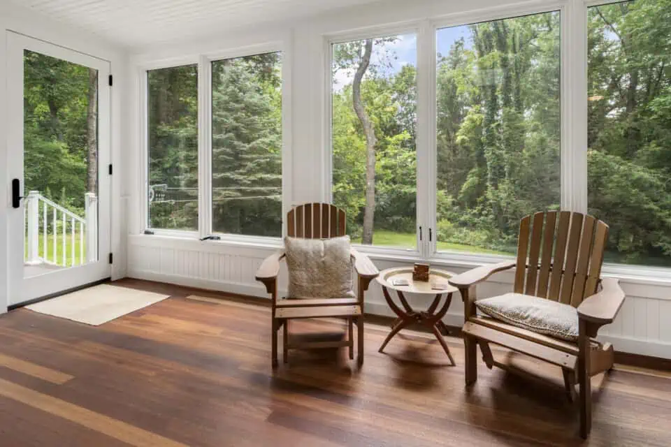 Two Adirondack chairs in Three-seasons room