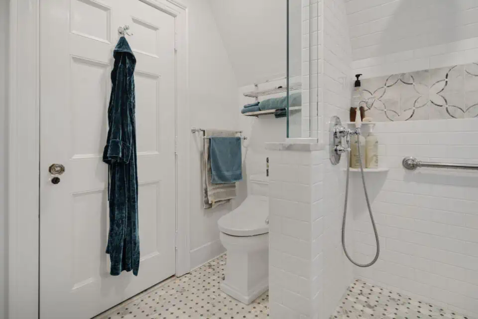 Tile "wet" bathroom with decorative toilet