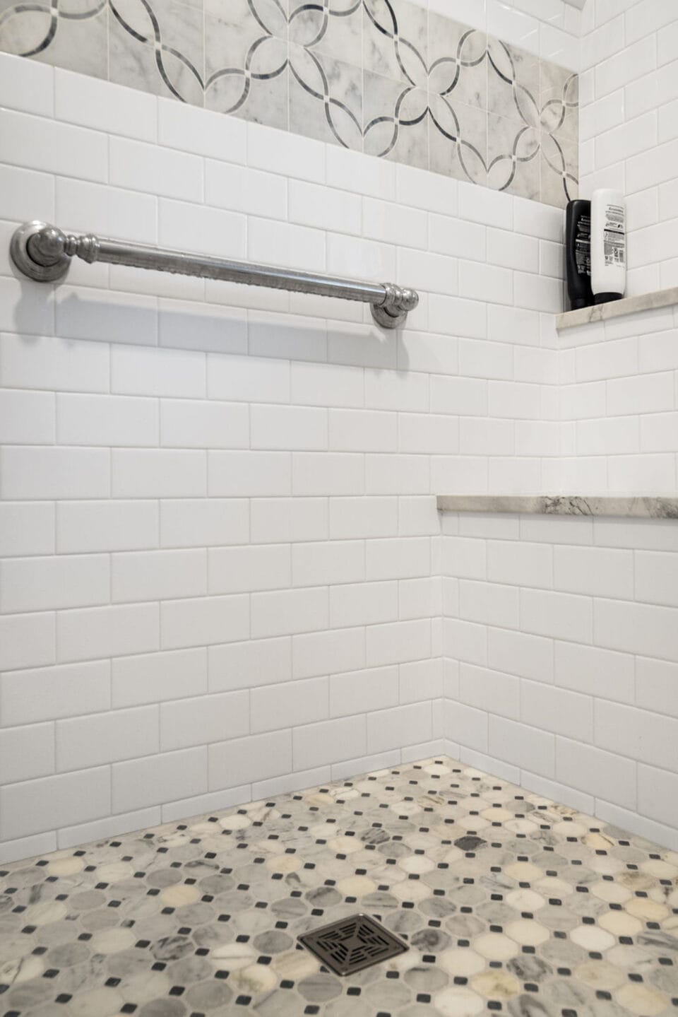 Grab bar in tile shower