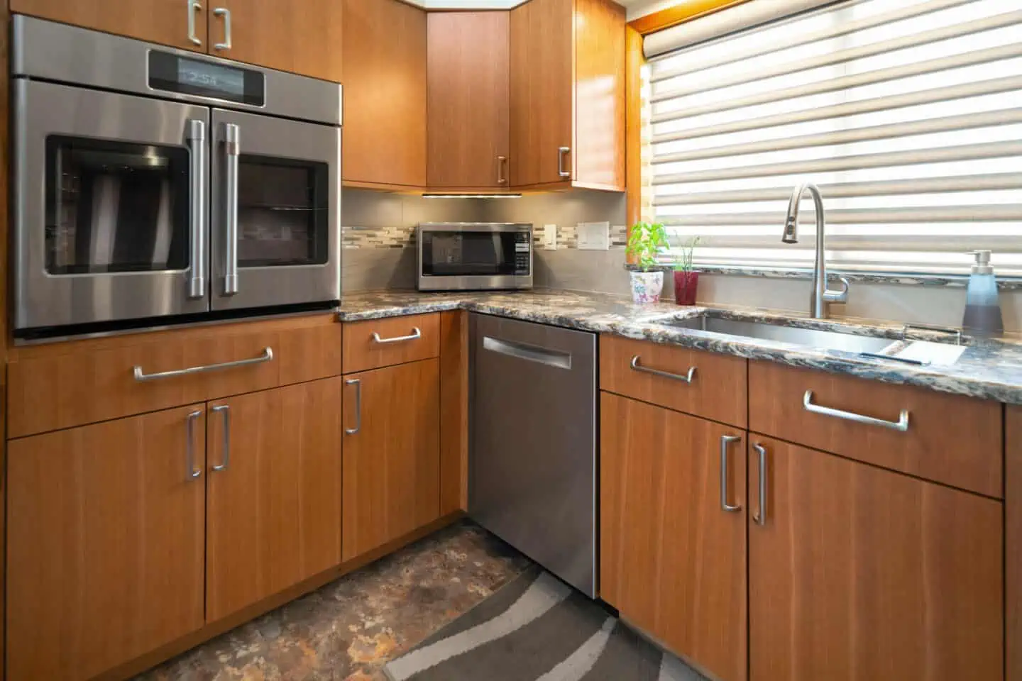 Remodeled kitchen with cabinet mounted oven