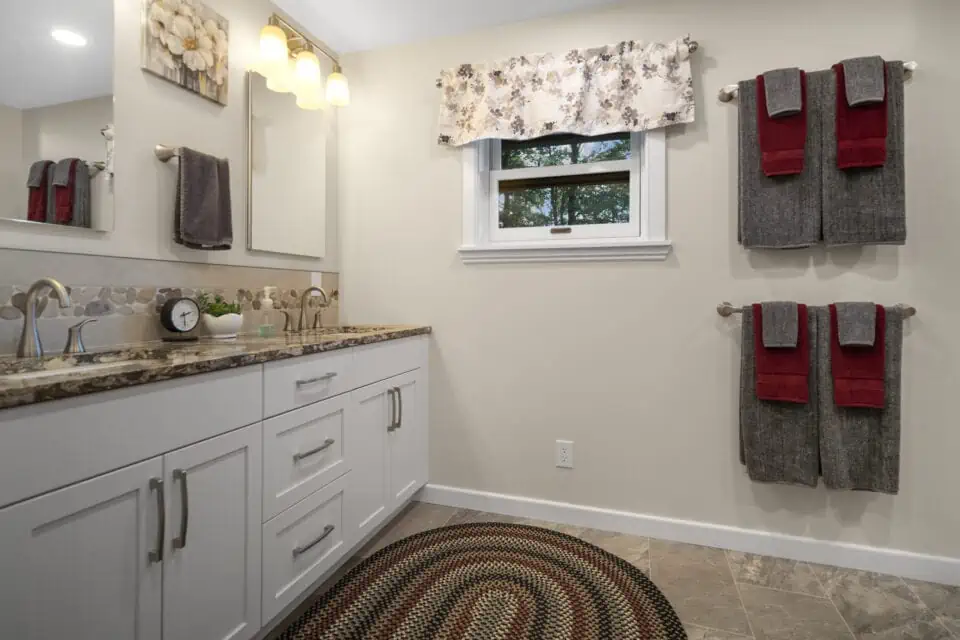 Remodeled bathroom with rug