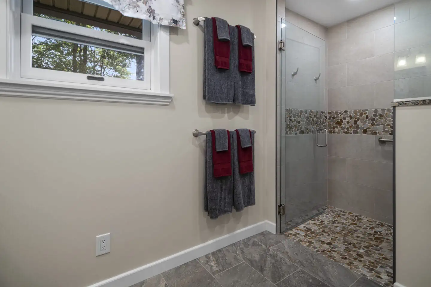 Bathroom with tile floor and accessible shower