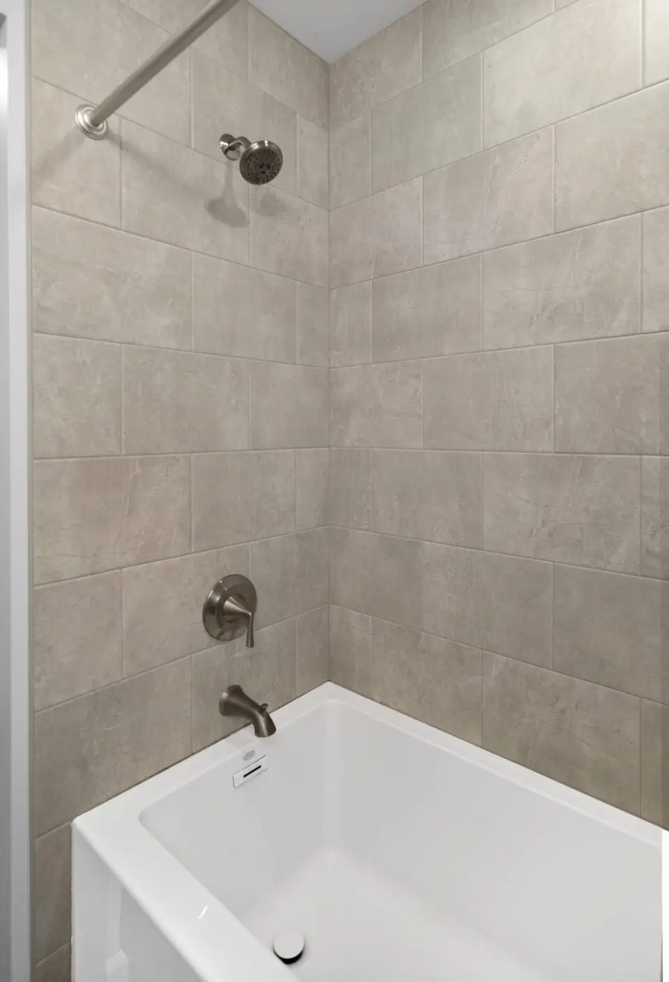 White tub with large tile surround