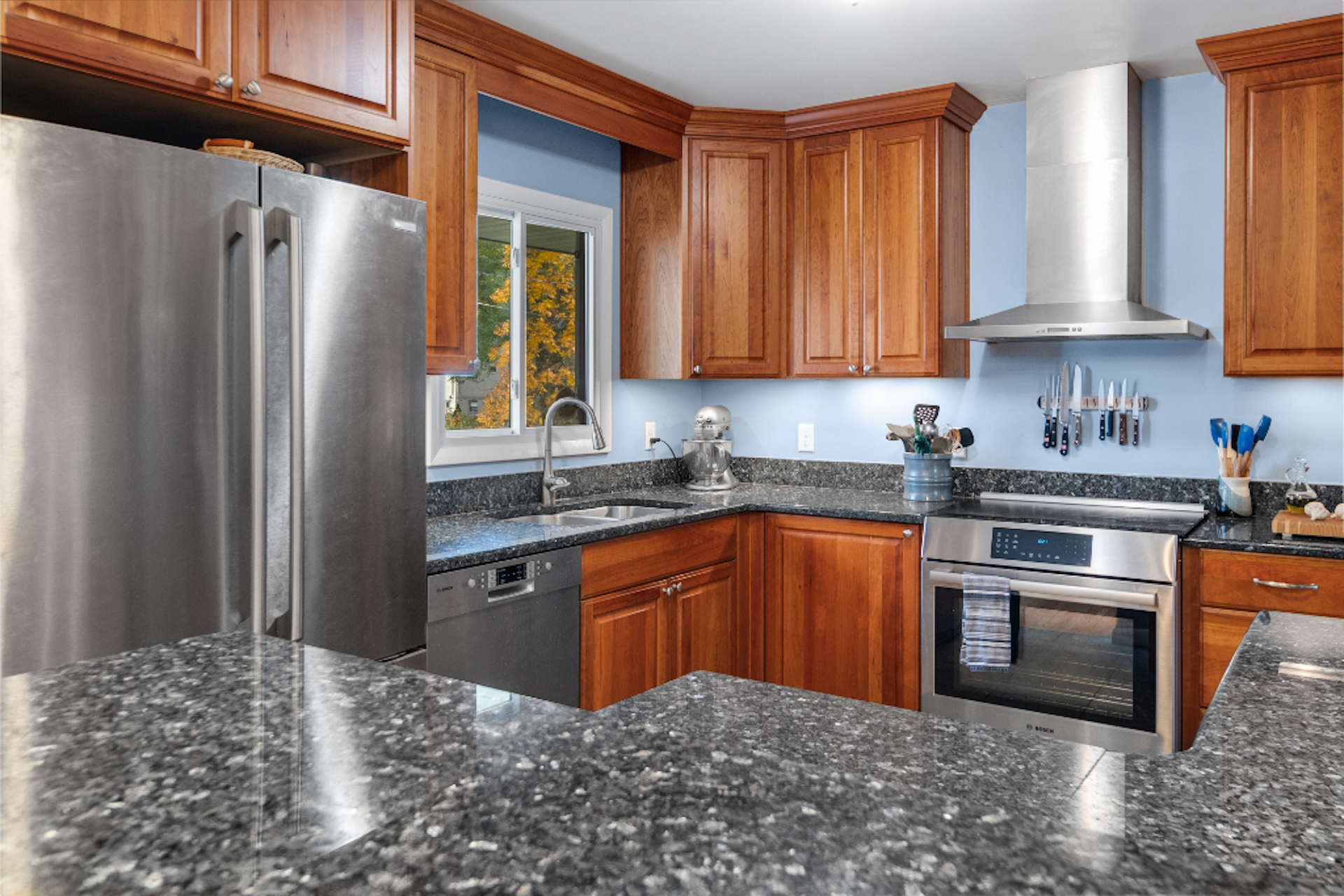 Kitchen with granite countertops and wood cabinets