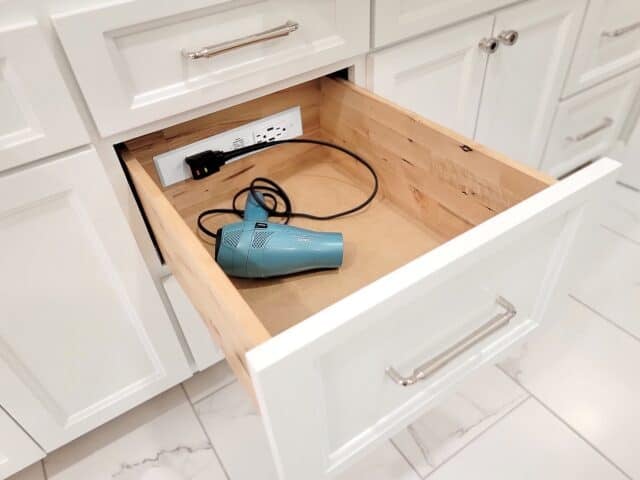 In-drawer power outlets are a really nice feature in a vanity. Image courtesy of Deanna Blackwell/Wheelhouse Design Company and Docking Drawer.