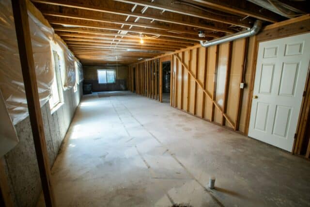 Basement with low ceiling unencumbered by many ducts